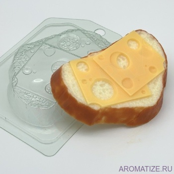 Хлеб белый с сыром, форма пластик Хлеб белый с сыром - это пластиковая форма бутерброда с сыром.  Вес изделия: 94г. Размеры формы: 110 × 79 × 18 мм.
